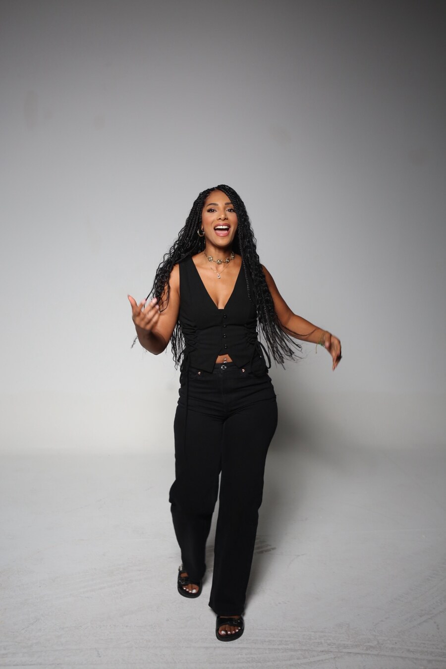 Cennet smiling in a studio